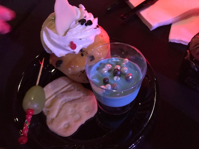 Blue milk panna cotta, stormtrooper shortbread cookie, "lightsaber" with grapes, and a BB-8 lemon cupcake